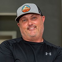 portrait of man in hat smiling